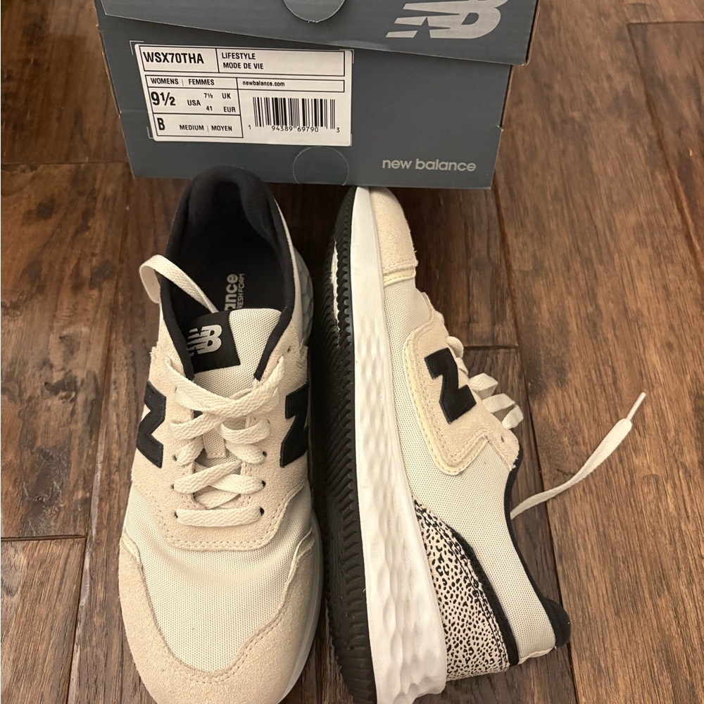 New Balance women’s Cream and Black Sneakers